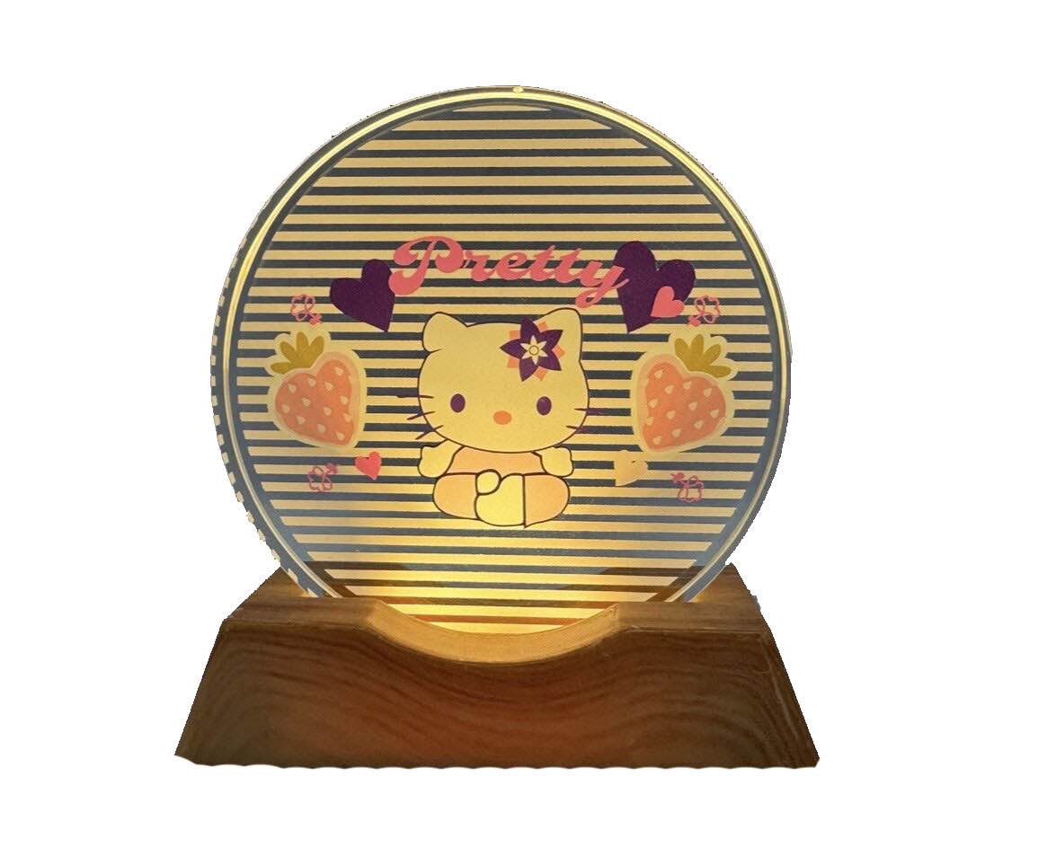 Hello Kitty LED desk light featuring a crystal-clear acrylic panel and a sleek wooden base